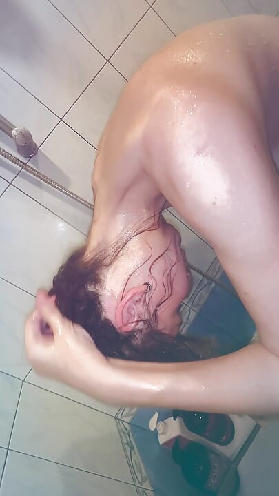 My step sis takin a shower and I film her big nipples and jerk off