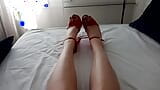 horny MILF translady talks in her sexy voice and shows off her red painted toes in her favorite red high heels snapshot 2