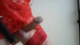 Man in red dress and panties spanking cock with hairbrush snapshot 2