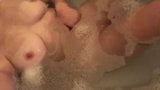 Touching herself in the bath snapshot 3