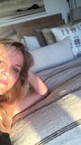 Reese Witherspoon laying on her bed, selfie vid snapshot 1