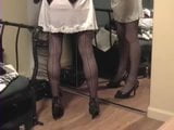 lifts skirt to show slip and stockings snapshot 9