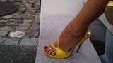 6 Putting on yellow strappy high heel sandals & zooming in. snapshot 8