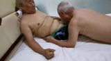 Two asian grandpas playing together snapshot 2