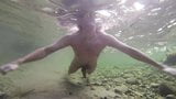 Boy swiming naked in the water snapshot 9