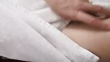 Home striptease after a shower in a white towel. Close-up snapshot 7