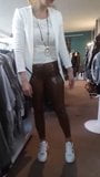 Wife in brown Latex Pants in her boutique snapshot 6