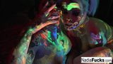 Black-light babes Nadia and Ophelia suck off a colorful cock snapshot 8