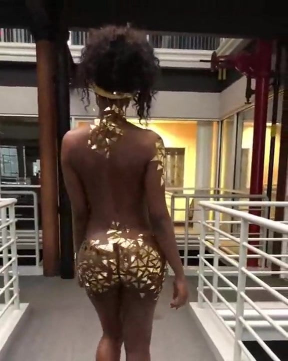 African Girl Wearing Gold Walks