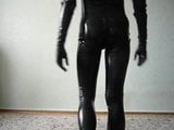 young man in latex catsuit caresses himself snapshot 1