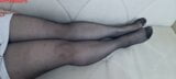 From another point of view, Anna's black pantyhose, legs and feet. snapshot 1