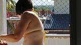 My wife using a micro bikini on balcony for workers see while the cuckold jerk off himself snapshot 1