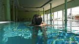 In the indoor pool, two stunning girls swim snapshot 9