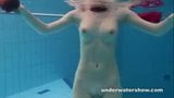 Redhead Mia stripping underwater snapshot 2