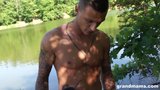 Horny mature taken advantage of by the lake by 2 young guys snapshot 2