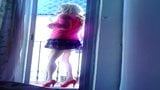 Submissive Lili cd in red heels looks out on the balcony snapshot 4