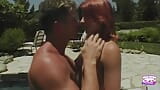 A saucy redhead gets her pussy eaten by the pool and gives a footjob snapshot 3