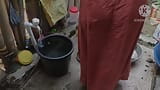 Indian Woman Washing Outside snapshot 2