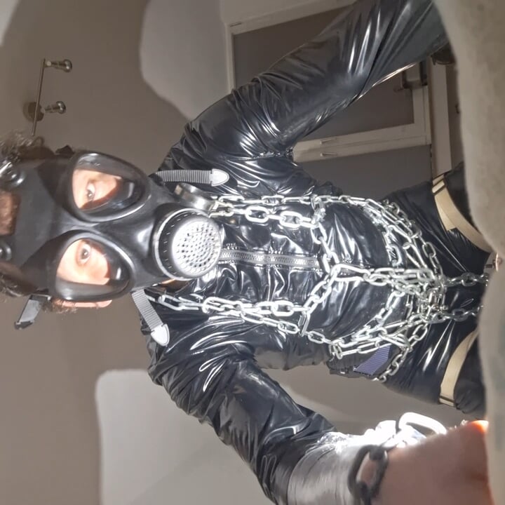 I'm already showing myself here in a tight vinyl dress and with a gas mask
