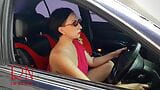 A lady masturbates in a car in a parking lot Teasing a clit with a dildo Depraved slut masturbates outdoors in city near snapshot 3