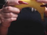 Katiegodess long sharp red nails sctratching banana snapshot 2