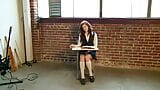 The cheeky schoolgirl is fooling around in the classroom with her percussion instruments. snapshot 2