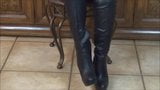 Putting on thigh high stilleto boots snapshot 5