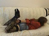 hogtied girl on couch snapshot 2