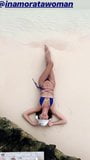 Emily Ratajkowski laying on the beach in a blue bikini snapshot 2