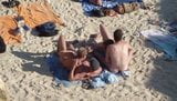 Group of guys having sex on the beach snapshot 7