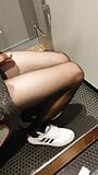 Black pantyhose in women's fitting room snapshot 7