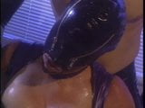 Latex clad couple in action snapshot 1