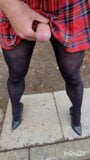 crossdresser in tartan skirt opaque tights and heels plays and cums in public snapshot 9