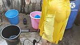 Indian house wife bathing outside snapshot 2