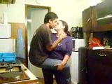 Woman carries her boy toy and kisses him snapshot 9