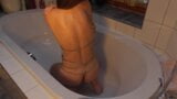 Girl in chain harness makes an enema in the bathtub snapshot 6