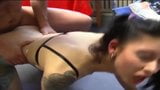 Une adolescente brune coquine prend une bite dans un magasin automobile snapshot 15