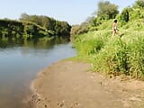 I'm posing on the riverbank in a white swimsuit snapshot 10