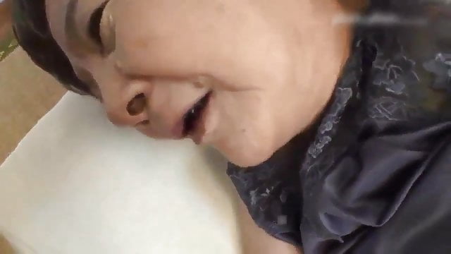 A petite Japanese grandma seduces a handsome young man.
