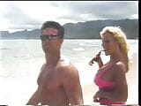 Tanned blonde and a dude are fucking on the beach snapshot 1