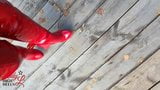 Lady L sexy walking with extreme red boots in forest. snapshot 8