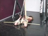 Lovely young slave girl in lingerie is restrained in the sex basement by master snapshot 5