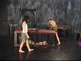 Three lesbians in torture chamber strip and one bends over for spanking snapshot 3