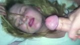 Blonde gets a big cum load in the face from a very fat cock snapshot 7