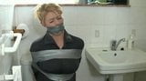 Girl Gets Duct Tape Wrap Gagged in the Bathroom snapshot 2