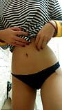 Daytime home striptease in a striped shirt. Close-up snapshot 7