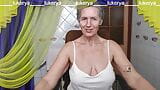 Cheerful housewife Lukerya hotly flirts with fans on webcam, controlling natural hanging boobs without the help of hands snapshot 1