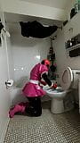 Une soubrette efféminée nettoie la salle de bain dans une ceinture de chasteté en acier avec un gode verrouillé en place snapshot 9