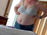 Big belly mature putting on bra snapshot 2