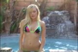 Blonde beauty with perky tits poses seductively by the pool snapshot 2